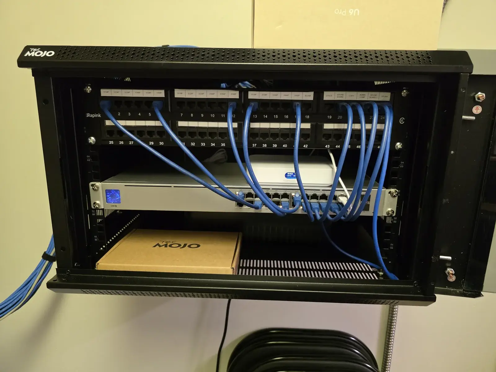 Completed open UniFi network rack at FBC Newton