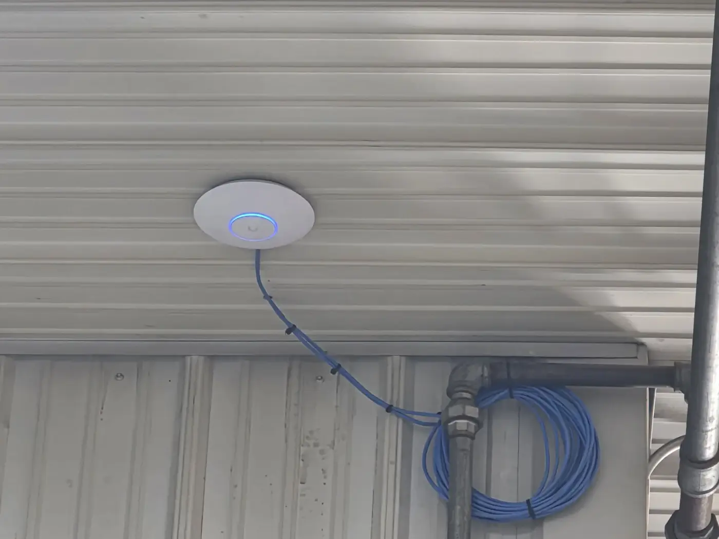 UniFi U7 Lite wireless access point installed for Graber Backhoe